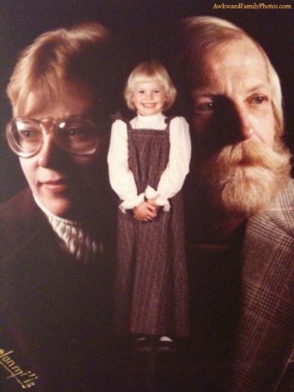 Yeah, I'm sure hovering over your child like gods isn't going to give them a complex...unless this is the cover of their folk band album, then it's fine.