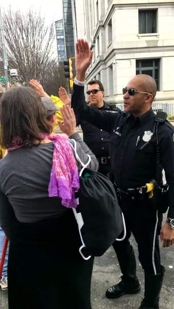 Gotta love a cop high-fiving demonstrators